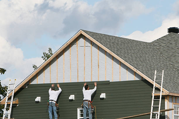 Professional Siding Installation technician working in Framingham, MA